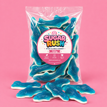 Blue Sharks Sugar Rush bag with sweets on pink background