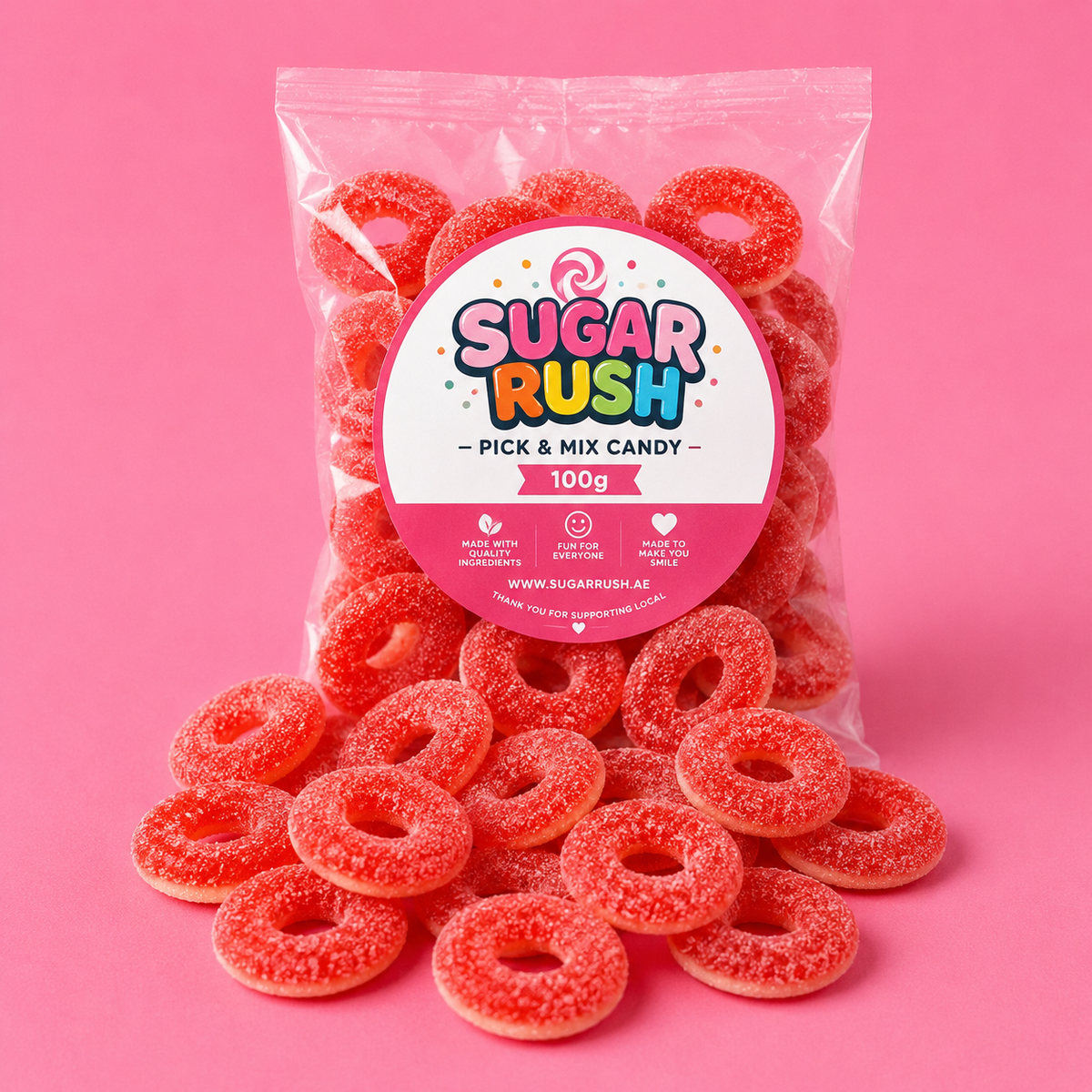 Fizzy Strawberry Rings Sugar Rush bag with sweets on pink background