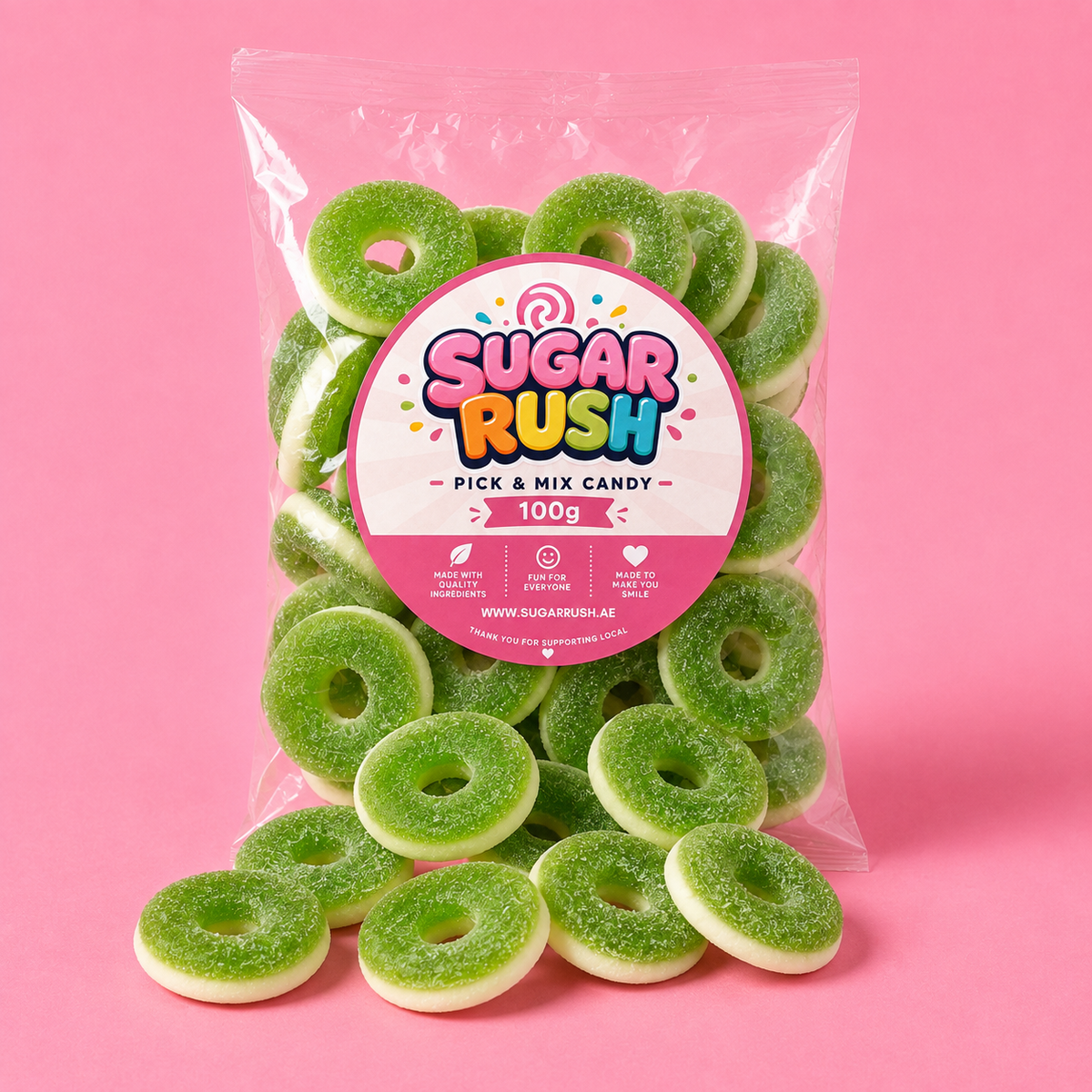 Green Apple Rings Sugar Rush bag with sweets on pink background