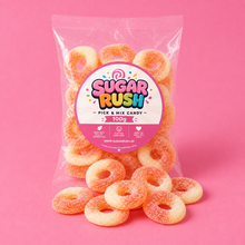 Peach Rings Sugar Rush bag with sweets on pink background