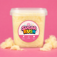 Sugar Rush Banana Cotton Candy Tub on a bright pink background with loose cotton candy