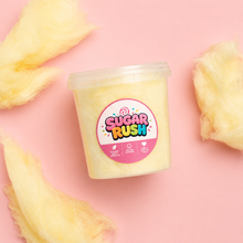 Top-down banana cotton candy tub and fluffy pieces on pale pink