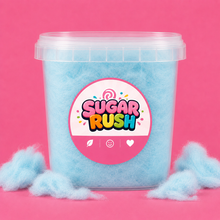 Sugar Rush Blue Raspberry Cotton Candy Tub on a bright pink background with loose cotton candy