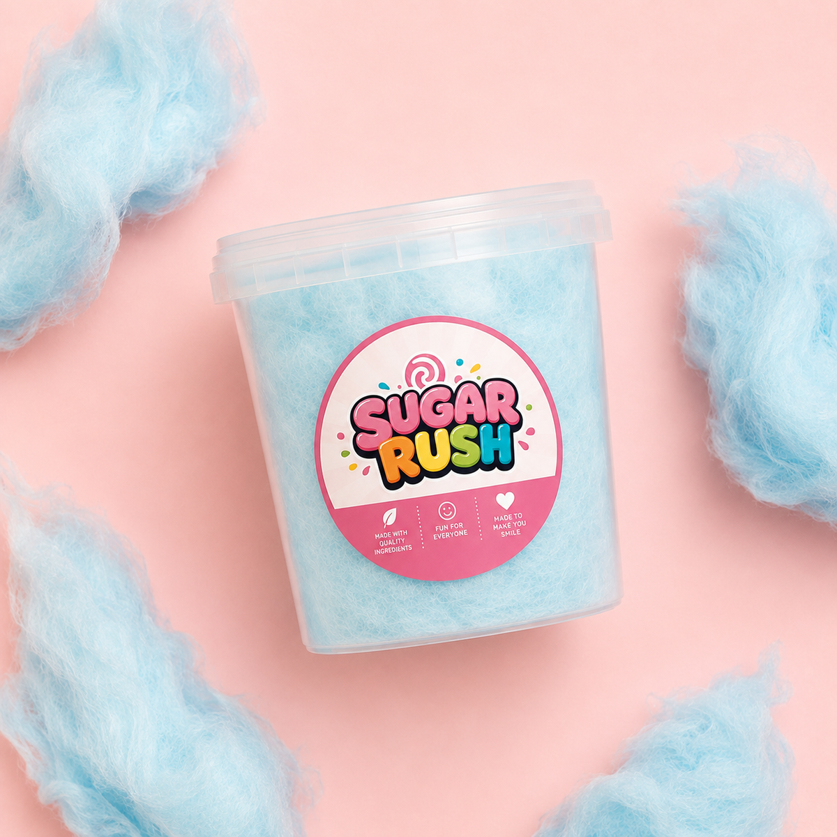 Top-down blue raspberry cotton candy tub and fluffy pieces on pale pink
