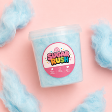 Top-down blue raspberry cotton candy tub and fluffy pieces on pale pink