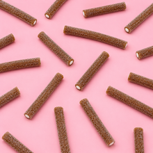 Overhead arrangement of Sour Cola Filled Pencils sweets