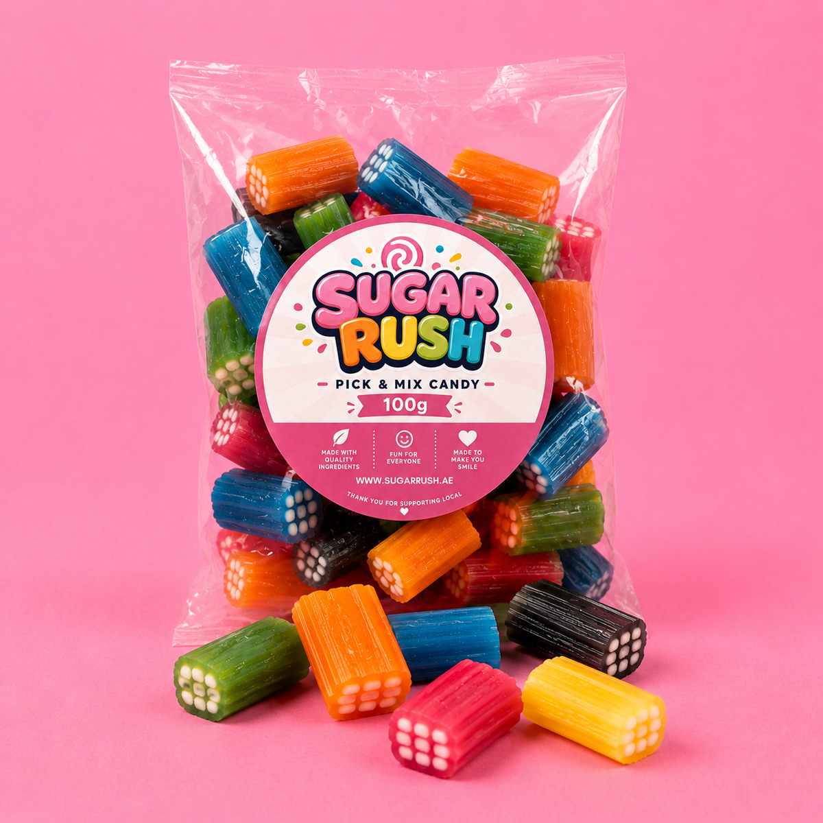 Liquorice Bricks Sugar Rush bag with sweets on pink background