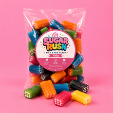 Liquorice Bricks Sugar Rush bag with sweets on pink background