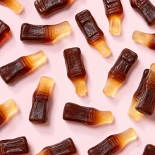 Overhead arrangement of Cola Bottles sweets
