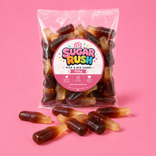 Cola Bottles Sugar Rush bag with sweets on pink background