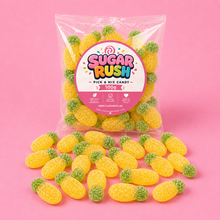 Sour Pineapples Sugar Rush bag with sweets on pink background