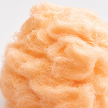 Close-up of fluffy orange cotton candy texture